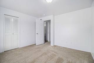 Bedroom with large closets and a bathroom at Hurwich Farms Apartments, South Bend, IN