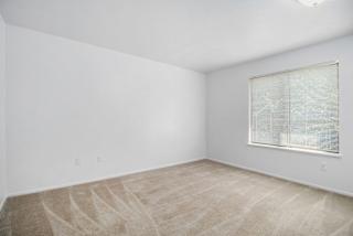 Bedroom with white closets and carpeting  at Hurwich Farms Apartments, South Bend, IN