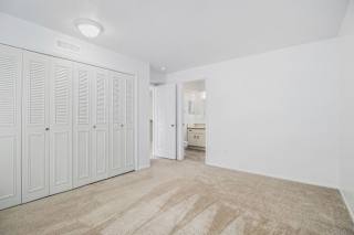 Bedroom with large closets and a bathroom at Hurwich Farms Apartments, South Bend, IN