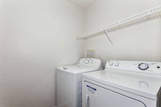 A laundry room with shelf at Limestone Creek Apartment Homes, Madison, AL, 35756