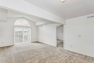 A two bedroom third floor living room with cathedral ceiling at Limestone Creek Apartment Homes, Madison, AL