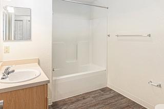 A bathroom with a sink and bathtub/shower at Limestone Creek Apartment Homes, Madison, AL