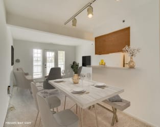 Dining Area with Living Room View at Northport Apartments, Macomb, Michigan