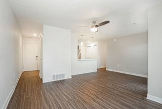 an empty living room with a ceiling fan at Meadowbrooke Apartment Homes, Grand Rapids, 49512