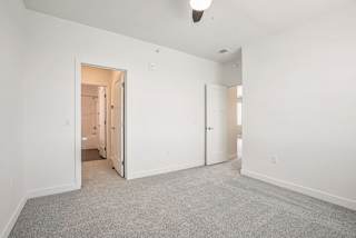 an empty living room with white walls and carpet at Meadowbrooke Apartment Homes, Grand Rapids, 49512