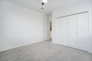 an empty living room with white walls and white doors at Meadowbrooke Apartment Homes, Grand Rapids, Michigan