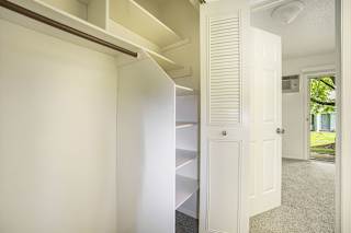 a large closet with shelves at Newport Village Apartments in Portage, MI