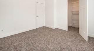 Bedroom with a walk-in closet at North Pointe Apartments in Elkhart, IN