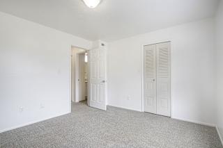 Bedroom with a walk in closet at North Pointe Apartments, Indiana, 46514
