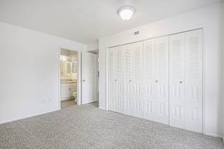 master bedroom with a large closet and a bathroom at North Pointe Apartments in Elkhart, IN