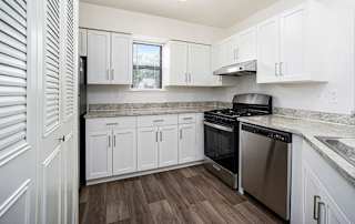 A kitchen with white cabinets at North Pointe Apartments, Elkhart, IN, 46514