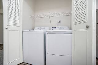 A full size washer and dryer in a small laundry room at North Pointe Apartments, Elkhart, IN, 46514