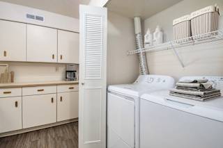 A kitchen laundry area with a washer and dryer at North Pointe Apartments, Elkhart, IN, 46514