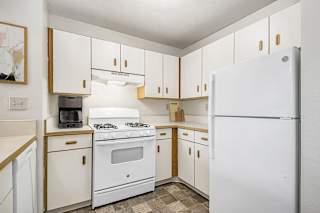 A kitchen with white appliances at North Pointe Apartments, Elkhart, IN, 46514