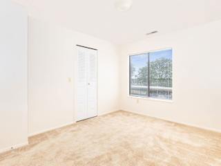an empty room with a window and a door  at Oak Shores Apartments, Oak Creek, 53154