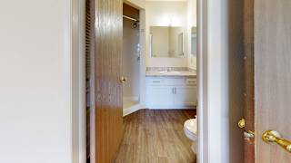 a bathroom with a toilet, sink and a shower at Oak Shores Apartments, Oak Creek, Wisconsin