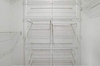 A walk-in closet with wardrobe organizers at Pine Knoll Apartments, Battle Creek