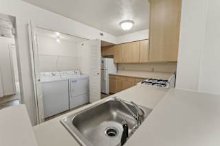 a kitchen with washer and dryer at Hunters Pond Apartment Homes, Illinois, 61820