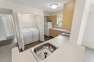 a kitchen with a washer and dryer at Hunters Pond Apartment Homes, Champaign, Illinois