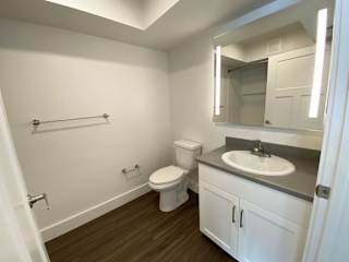 A bathroom with hard surface flooring at Green Ridge Apartments, Grand Rapids, 49544
