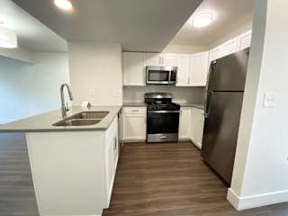 A kitchen with stainless steel appliances at Green Ridge Apartments, Grand Rapids, MI, 49544