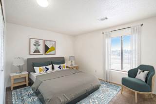 a bedroom with a bed and window at Seville Apartments, Kalamazoo, MI, 49009