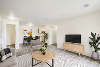 a living room and dining room at Seville Apartments, Kalamazoo, MI, 49009