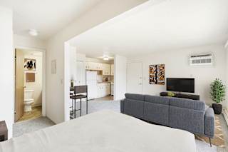 studio living areas with furniture at Seville Apartments in Kalamazoo, MI 49009