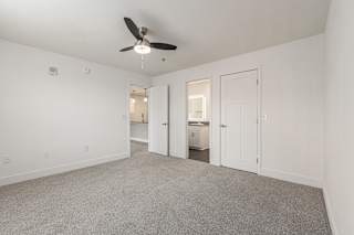 Bedroom with a ceiling fan and doors to a 2nd bathroom and closet  at Signature Pointe Apartment Homes, Athens, 35611