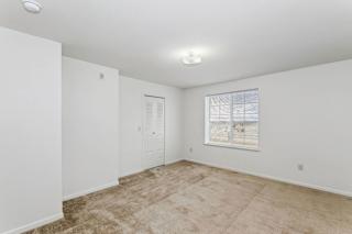 spacious bedroom with carpet at Stoney Pointe Apartment Homes, Wichita, KS, 67226