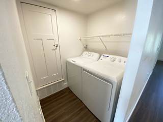 a washer and dryer in laundry room at Stoney Pointe Apartment Homes, Wichita, KS