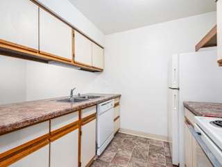a kitchen with a sink, refrigerator and dishwasher at Tanglewood Apartments, Oak Creek, WI, 53154