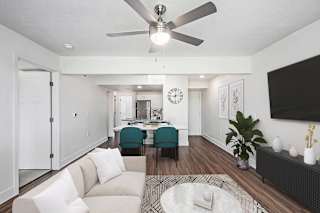 living room with a ceiling fan at The Crossings Apartments, Michigan, 49508