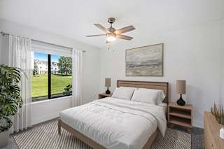 bedroom with a large window at The Crossings Apartments, Michigan, 49508