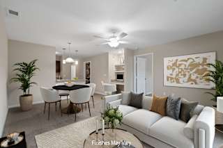 Open living and dining room with round table at Badger Canyon Apartments, Kennewick, 99338