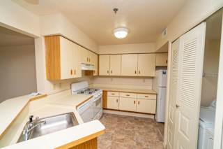 Kitchen with dishwasher and washer and dryer  at Windmill Lakes Apartments, Holland, 49424