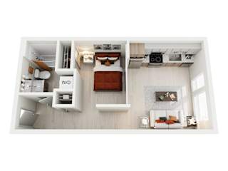 A top-down view of a modern, studio apartment home at ION Queen Anne with a bed, a desk, and a couch.