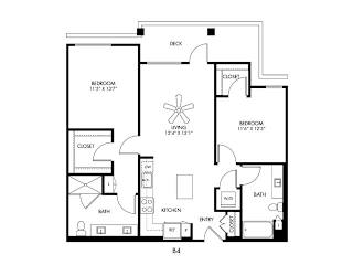 A black and white floor plan of a house with two bedrooms, a living room, a kitchen, a bathroom, and an entry closet.