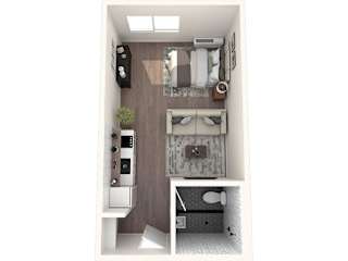 A small room with a bed, a desk, and a chair.