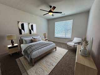 Modern bedroom with neutral tones and abstract wall art at The Wren Apartments, Lawrenceville, GA 30043