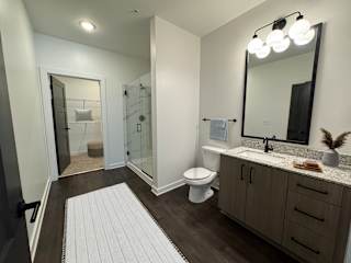 Spacious bathroom with glass shower and vanity at The Wren Apartments, Lawrenceville