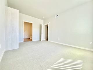 2 bed 2 bath bedroom with carpet