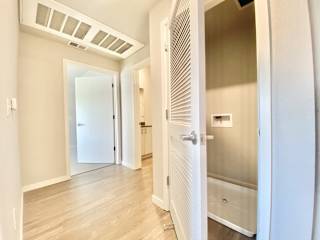 3 bed 2 bath hallway looking at washer/dryer closet