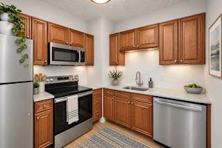 A kitchen with wooden cabinets and stainless steel appliances.