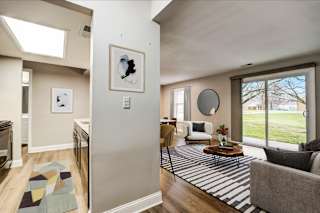 A living room with a grey couch and a coffee table.
