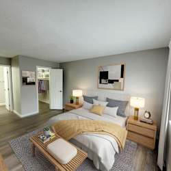 A bedroom with a bed, nightstand, and a painting on the wall.
