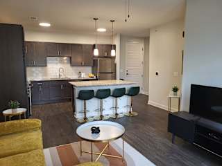 Kitchen with Island and Bar stools at Wesmont, Indianapolis