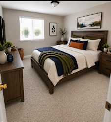 A bedroom with a bed, nightstand, and a painting on the wall.