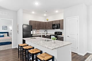 Kitchen with black refrigerator at Highview Pointe, Kentucky, 40228