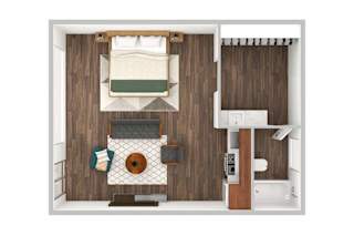 A small room with a bed, a table, and a chair.